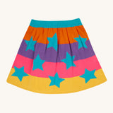 Frugi Rory Reversible organic cotton kids Skirt with a Rainbow Stars design shown on the rainbow stripe side.