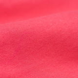 A close up of the Frugi kids libby leggings in rose showing the knit detail on bright pink organic cotton fabric.