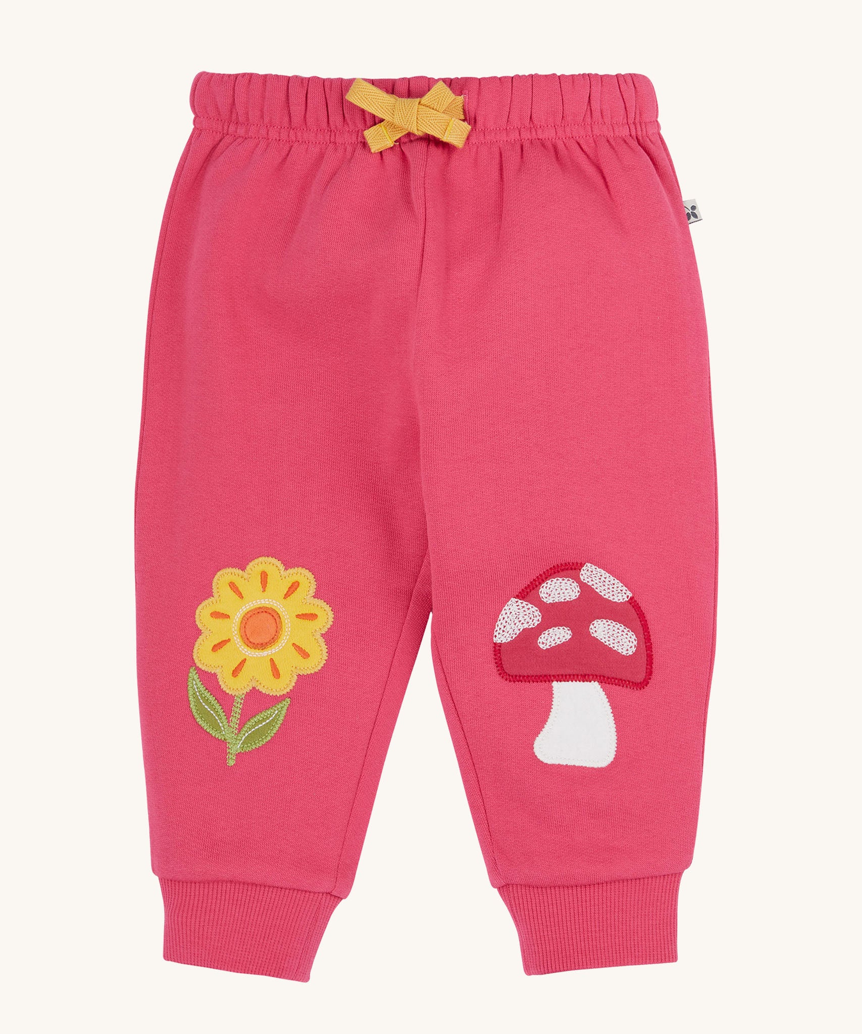 Frugi rose pink coloured flower and mushroom crawlers organic cotton kids joggers.