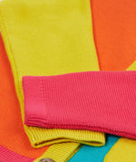 Close up of the Frugi kids Rose pocket cardigan, happy pen pot. Showing the pink and yellow arm cuff on organic knitted cotton fabric
