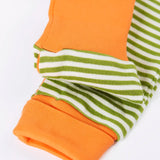 Frugi GOTS 100% organic cotton romper in green and white stripe showing a close up of the fold over cuffs for extended wear.