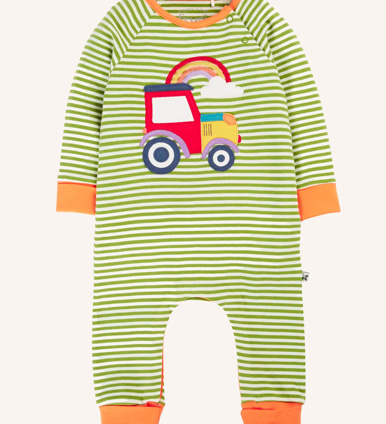 Frugi Rowan romper with green and white strath stripe ans a red tractor and rainbow applique on the front. Fold over cuffs on arms and legs for extended wear.