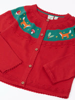 Close up of the Frugi scarlet red organic cotton ishbel embroidered fox cardigan. Red knit child's cardigan with a teal band from shoulder to shoulder decorated with embroidered foxes, holly, toadstools and trees.