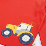 Frugi GOTS organic cotton red long sleeve top showing a yellow tractor applique on the bottom 