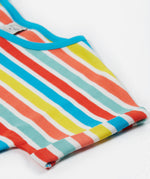 A close up of Frugi Faye Dress, showing the Sea Rainbow Stripe print and one of its folded sleeves.