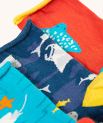 A close up of the roll tops on the Frugi pack of three sealife themed bamboo children's socks. A looser fit roll top for comfort.