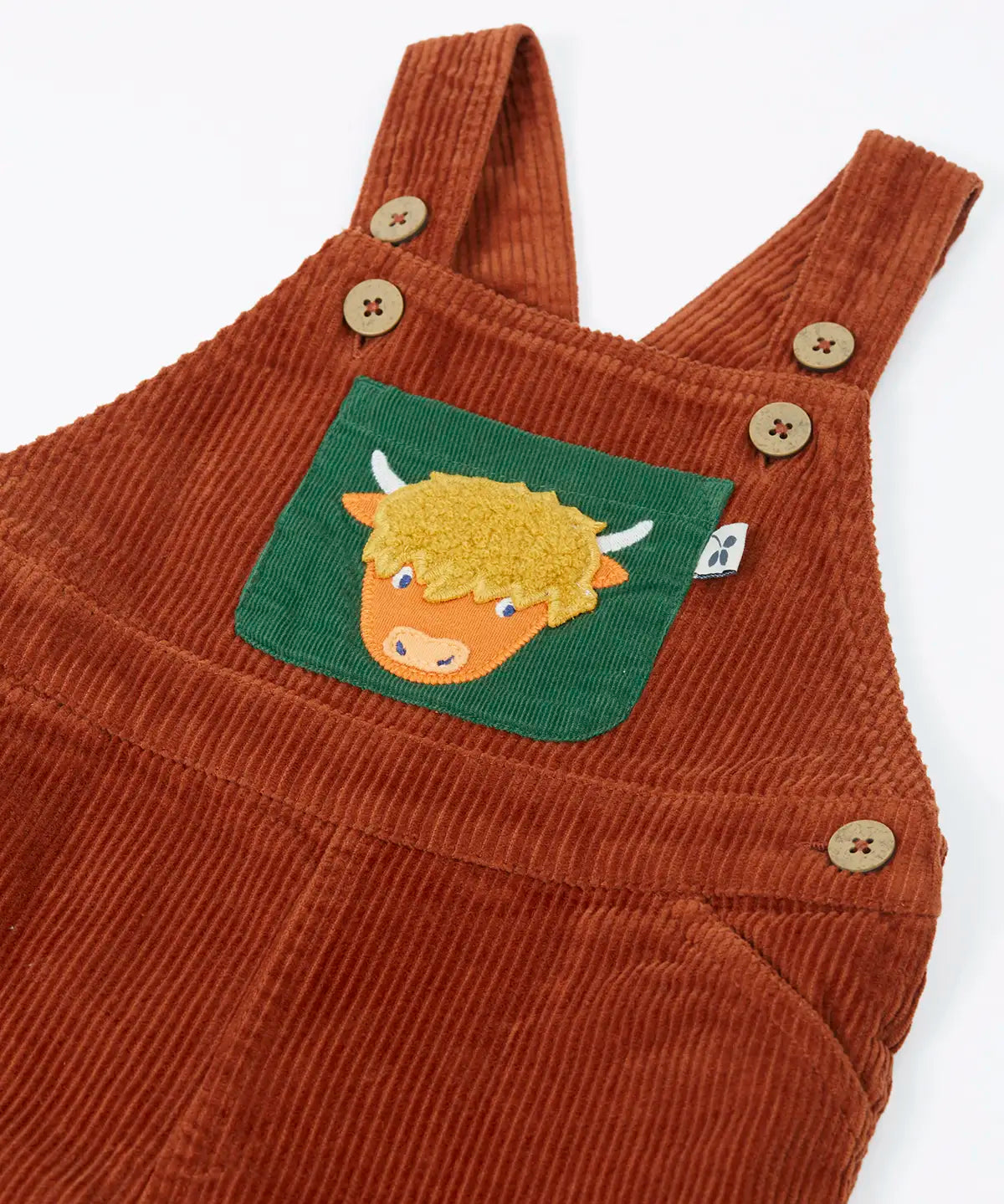 Frugi brown rust organic cotton cord dungaree laid flat showing close up of the adjustable shoulder straps with buttons