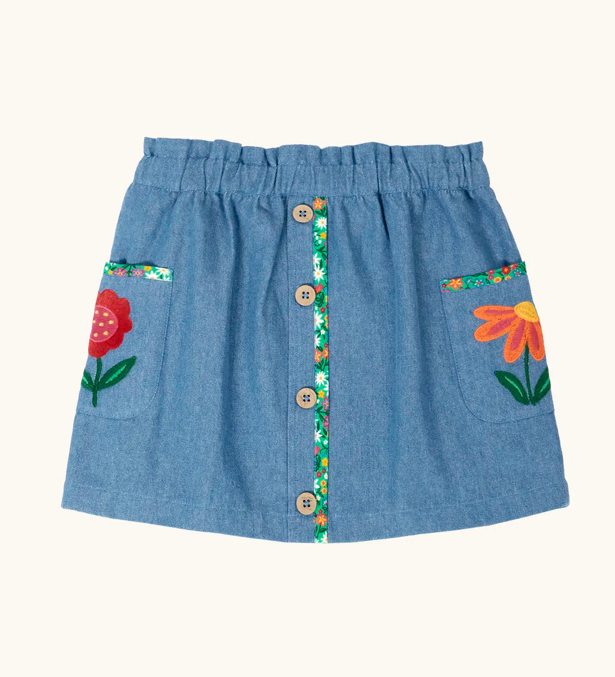 Frugi Selena child's denim skirt with wildflower trims and wildflower embroidery on the side pockets.
