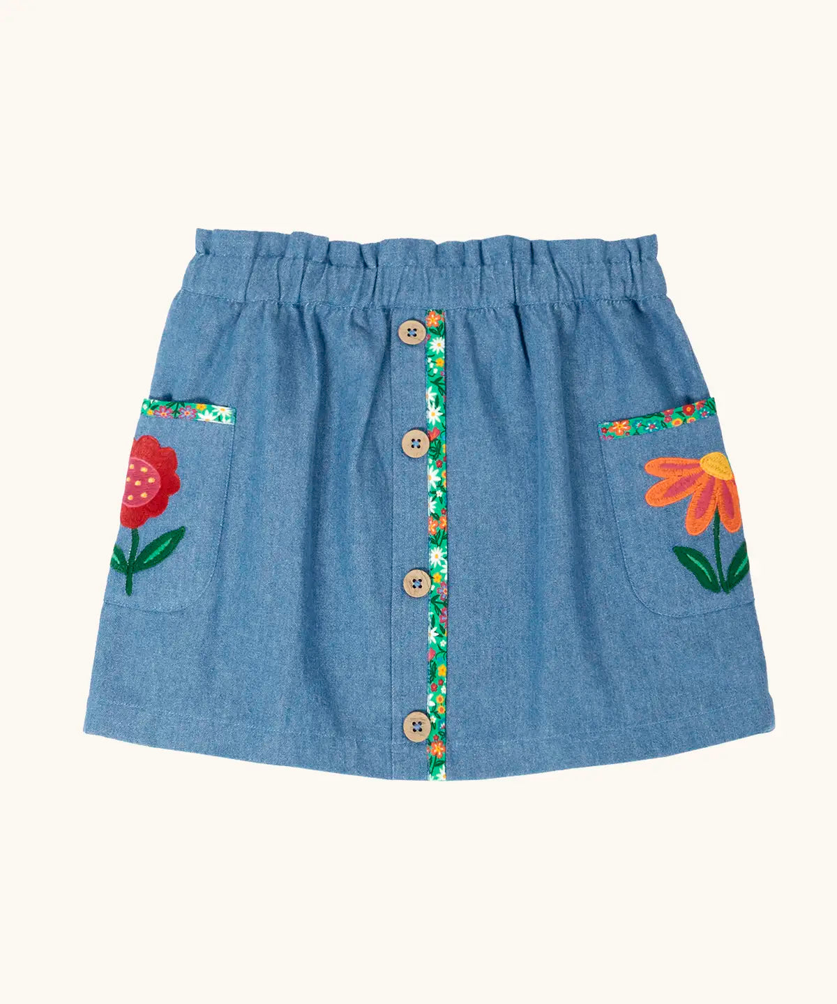 Frugi Selena child's denim skirt with wildflower trims and wildflower embroidery on the side pockets.