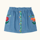 Frugi Selena child's denim skirt with wildflower trims and wildflower embroidery on the side pockets.