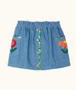 Frugi Selena child's denim skirt with wildflower trims and wildflower embroidery on the side pockets.
