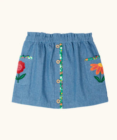 Frugi Selena child's denim skirt with wildflower trims and wildflower embroidery on the side pockets.