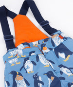 A close up of the Frugi penguin waddle snow and ski salopettes showing the removable  dark navy shoulder strap orange fleece panel on the back of the bib