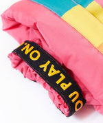 A close up of the Frugi rainbow check snow and ski salopettes showing the pink snow cuff detail 