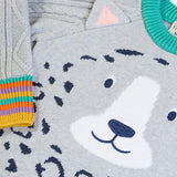 Close up Frugi snow leopard organic cotton character knit jumper with 3d ears, green neck trim and rainbow arm cuffs and hemline. 