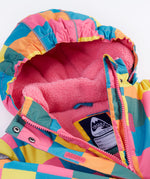A close up of the Frugi kids snow and ski coat in rainbow check showing the pink zip detail and matching fleece with the name tag patch stitched on the inside