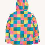 The back of the Frugi kids snow and ski coat in rainbow check showing the hood detail, pink storm cuffs and reflective strips and patches on recycled polyester fabric