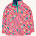 Frugi tulip pink kids snuggle fleece with a fun flowers design. These fleeces are made with organic cotton.