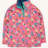 Frugi tulip pink kids snuggle fleece with a fun flowers design. These fleeces are made with organic cotton.
