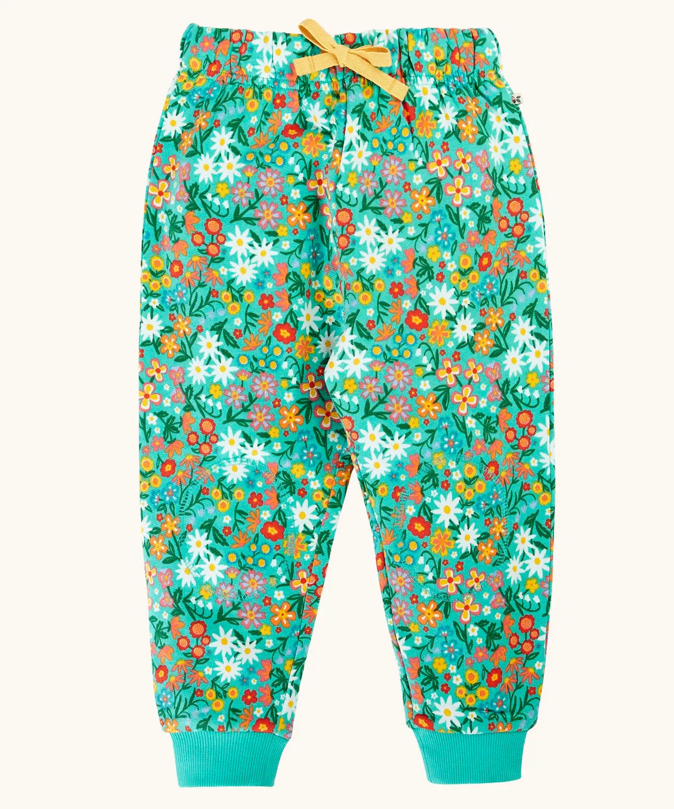 Frugi organic cotton kids snuggle joggers in green with an all over wildflower wander themed print.