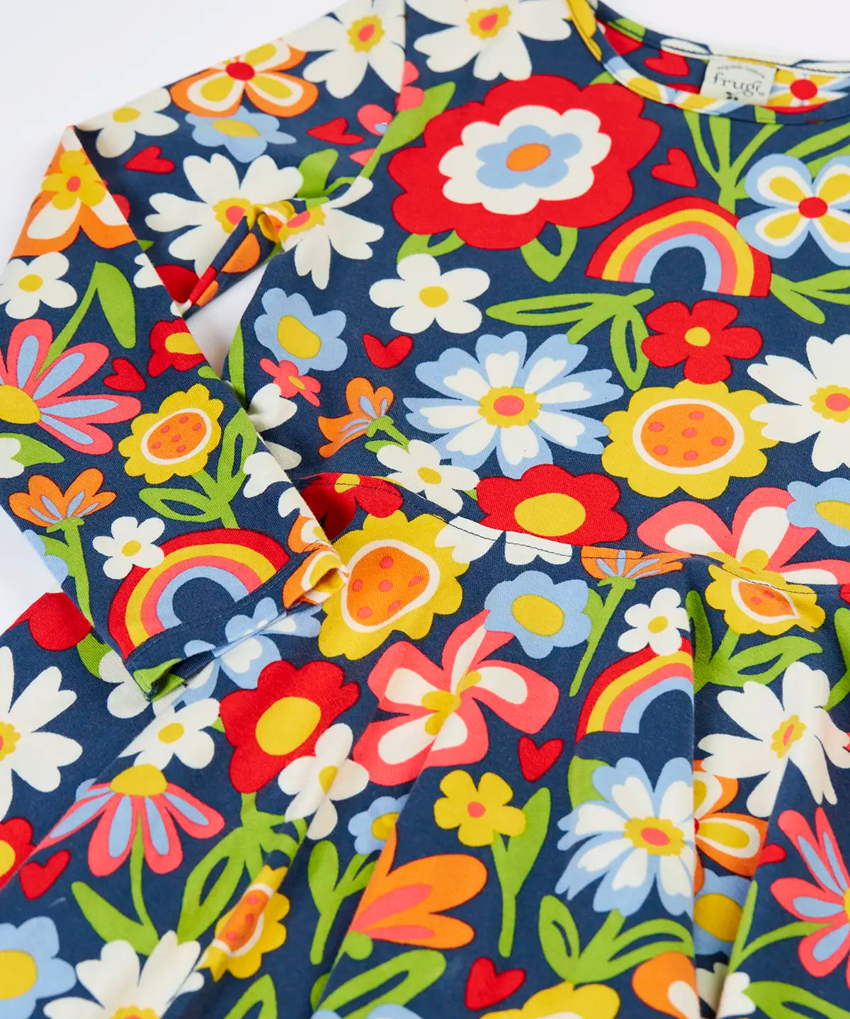 Close up of the Frugi Sofia organic cotton skater dress with a beautiful bunch all over flower print. 