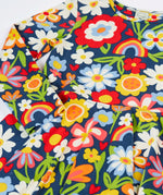 Close up of the Frugi Sofia organic cotton skater dress with a beautiful bunch all over flower print. 