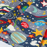Close up of the skirt on the Frugi Sofia organic cotton skater dress in navy with an all over explore the stars print. 