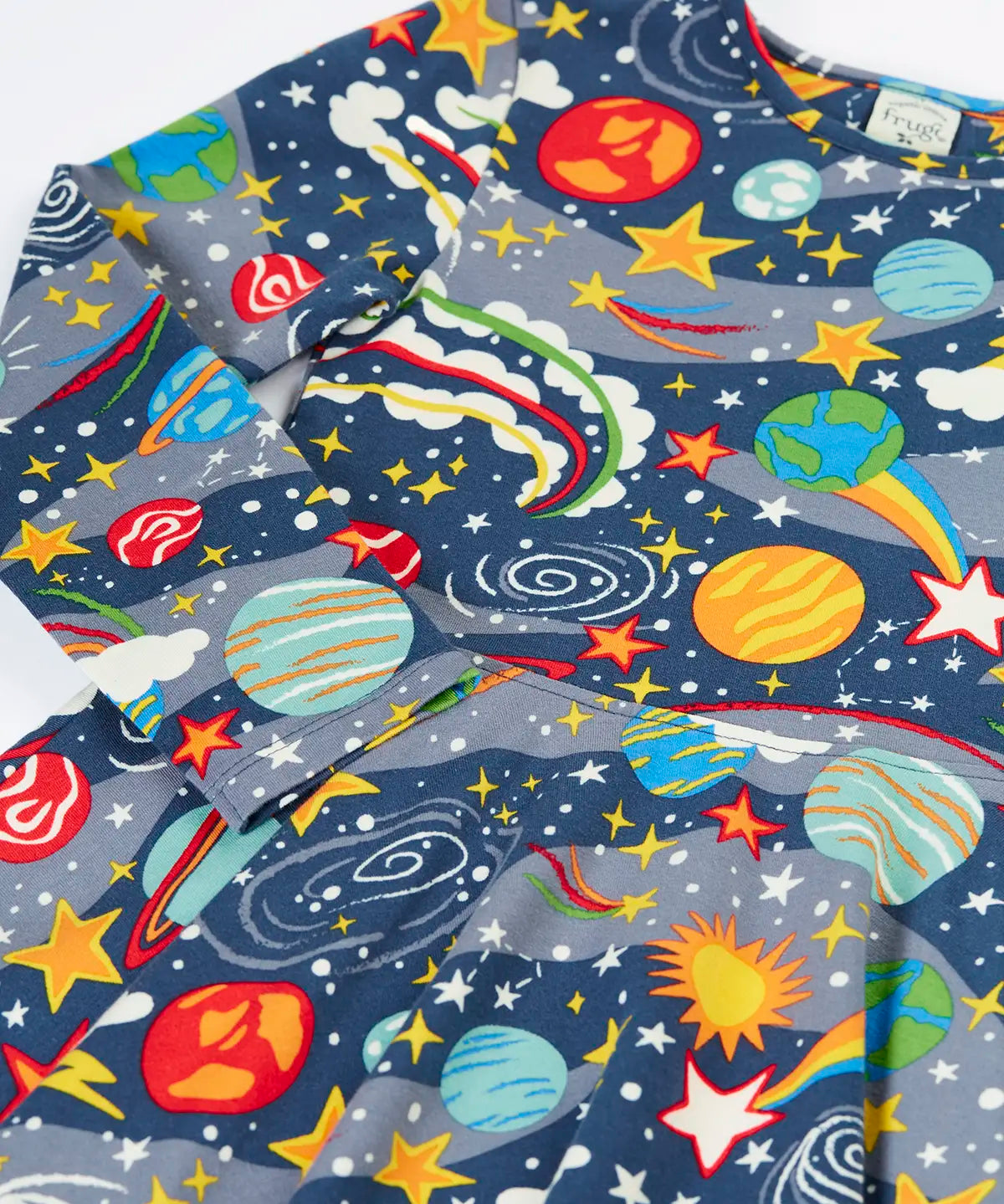 Close up of the Frugi Sofia organic cotton skater dress in navy with an all over explore the stars print. 