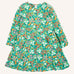 Frugi Sofia organic cotton kids long sleeved skater dress in green with an all over wildflower wander print. 