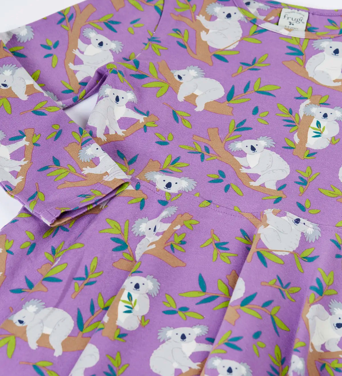 Close up of the Frugi Sofia organic cotton skater dress in purple with an all over koala cuddles print.