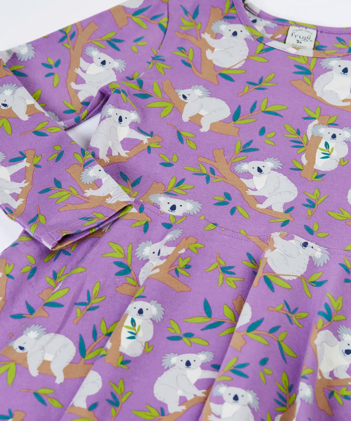 Close up of the Frugi Sofia organic cotton skater dress in purple with an all over koala cuddles print.