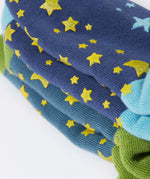 A close up of the green srippy stars on the bottom of the Frugi Festive Reindeer Great Organic Cotton Grippy Socks for Kids 2 Pack. These socks are part of a wide range of organic cotton clothing for children available here at Babipur. 