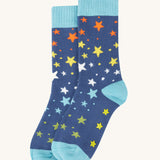 The star print pair of socks from the Frugi Festive Reindeer Great Organic Cotton Grippy Socks for Kids 2 Pack. These socks have green coloured grippy stars on the soles. These socks are part of a wide range of organic cotton clothing for children available here at Babipur. 