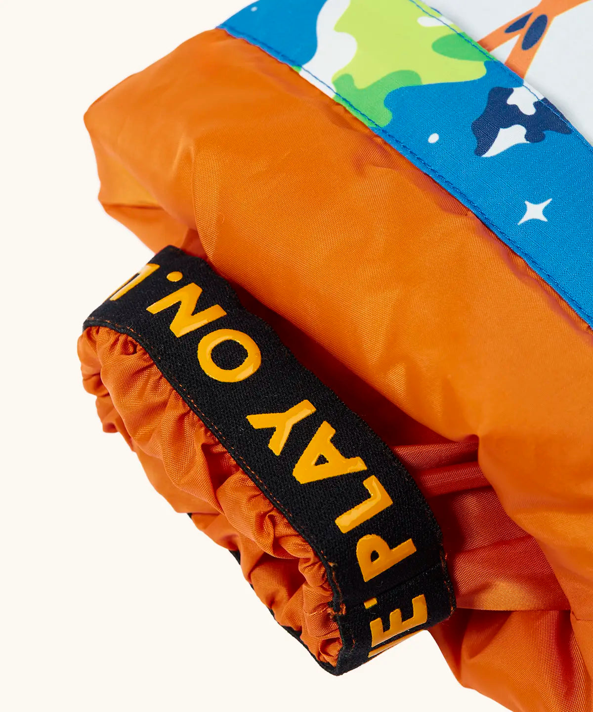 Frugi starry slopes snow and ski salopettes showing close up of the orange elasticated cuff 