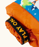 Frugi starry slopes snow and ski salopettes showing close up of the orange elasticated cuff 