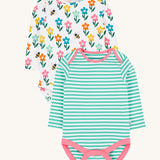 A set of two Frugi super special long sleeved baby vests. One has a turquoise blue and white striped design and the other has a happy flowers all over print on a white background.