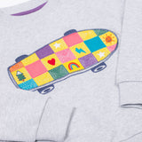 A zoomed in view of the  Frugi Superb Stitched Skateboard sweatshirt. This organic cotton long sleeved, marl grey coloured jumper features a colourful skateboard design on the front.