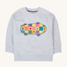 A Frugi Superb Stitched Skateboard sweatshirt. The front of the grey coloured child's jumper has an embroidered skateboard with checkerboard design.