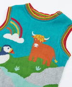 Close up of the rainbow stripes neckline and arm holes on the Frugi Tavi knitted tank top with a highland scenes design.