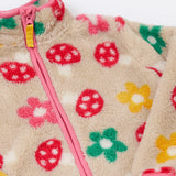 A close up of the Frugi mushroom field ted stripe fleece showing the pink trim and turn up collar