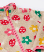 A close up of the Frugi mushroom field ted stripe fleece showing the pink trim and turn up collar