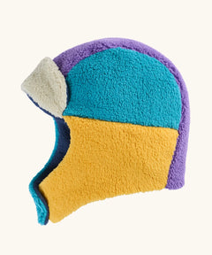 A fleece aviator-style frugi winter hat in a color-blocked pattern of teal, mustard yellow, purple, and cream.