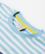 A close up of the Frugi kids bluebird tennis t-shirt. Showing the light blue neck trim with a yellow trim on the inside on white striped organic cotton fabric