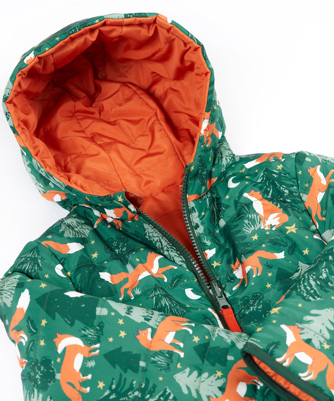 A close up of the Frugi toasty trail reversible jacket showing the playful fox in woodland design with a green zip and hood detail.