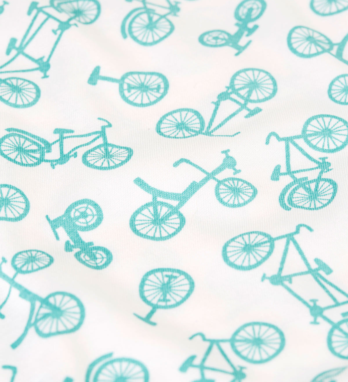A close up of the blue bicycle print on one of the vests from the Frugi varlie vest 2 pack multipack. 