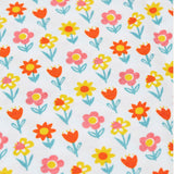 A close up of the orange, yellow, pink and turquoise coloured bloom flower print on one of the organic cotton children's vests from the Frugi varlie bloom vest 2 pack multipack.