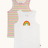 A pack of 2 Frugi varlie sleeveless, organic cotton children's vests. One vest a rainbow stripe design one is white with a rainbow in the middle of the chest area. 