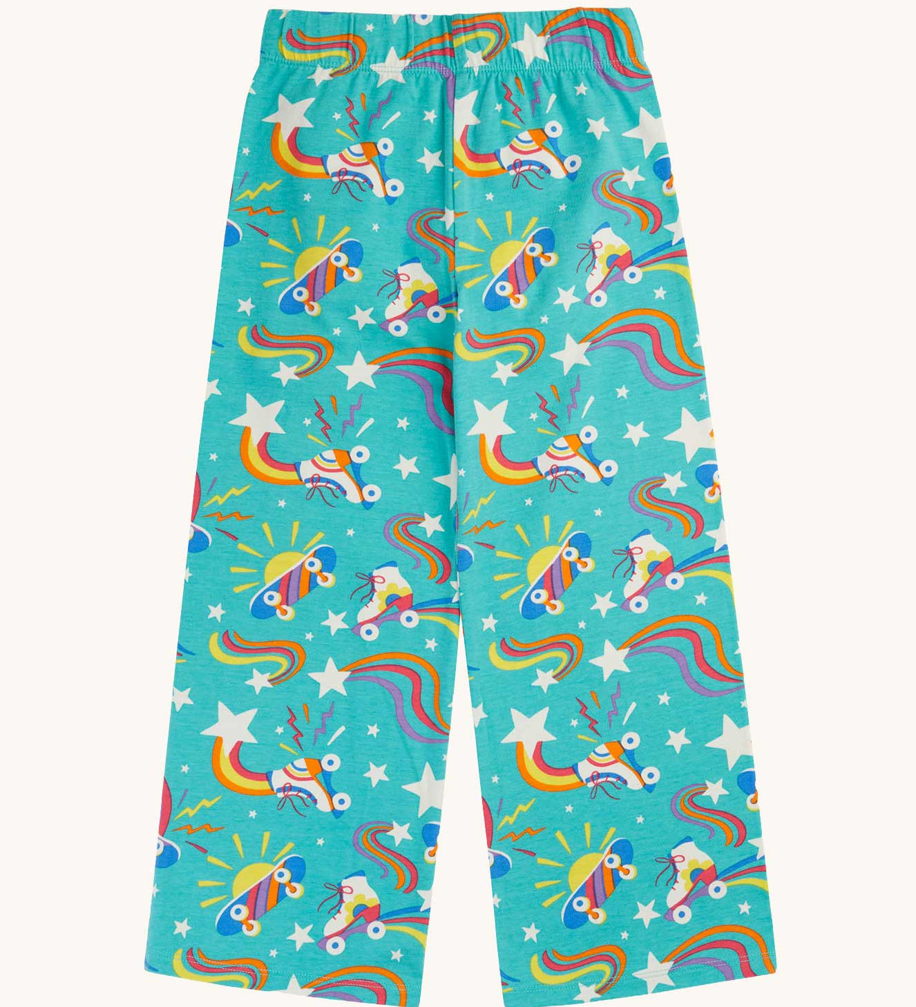 Frugi wide leg trousers with an all over wheely happy rainbow roller blades and skateboard print on a teal background.