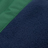 A close up of the navy fleece lining on the Frugi Wilderness green trousers with navy blue coloured knee patches.