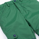 A close up of the Frugi Wilderness green trousers with navy blue coloured knee patches.